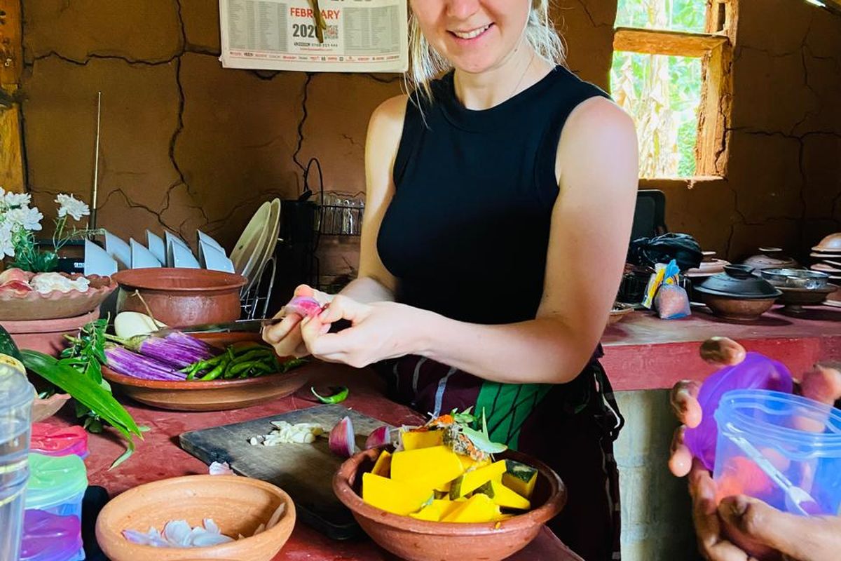 Guest preparing fresh vegetables and spices for a Sri Lankan curry