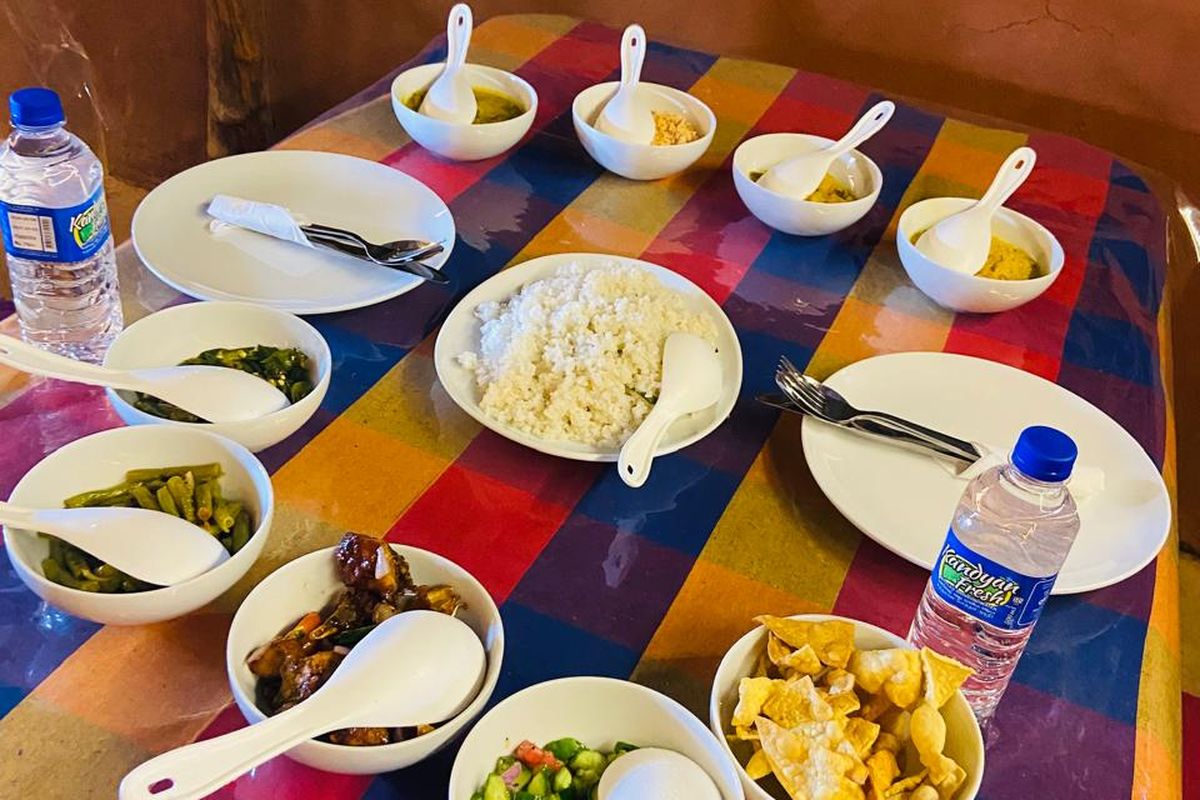 Table spread with rice and several Sri Lankan curries
