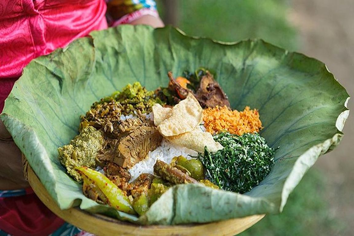 Rice and curry served on a lotus leaf